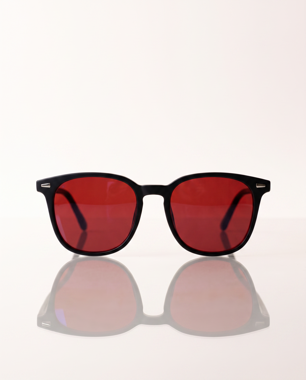 Blue Light Blockers — front-on with mirror reflection on light background