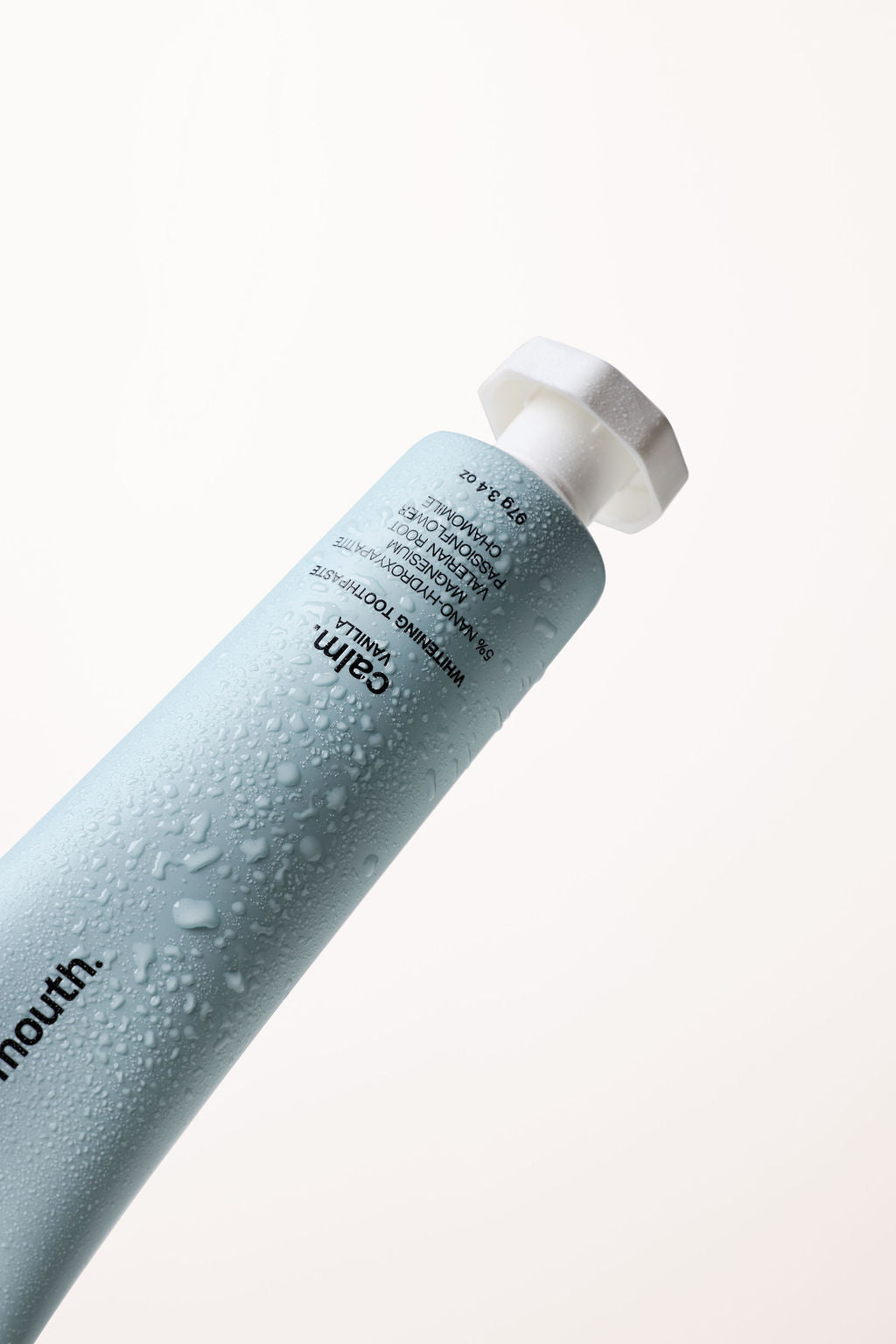 Word of Mouth whitening toothpaste and toothbrush styled for an evening wind-down routine