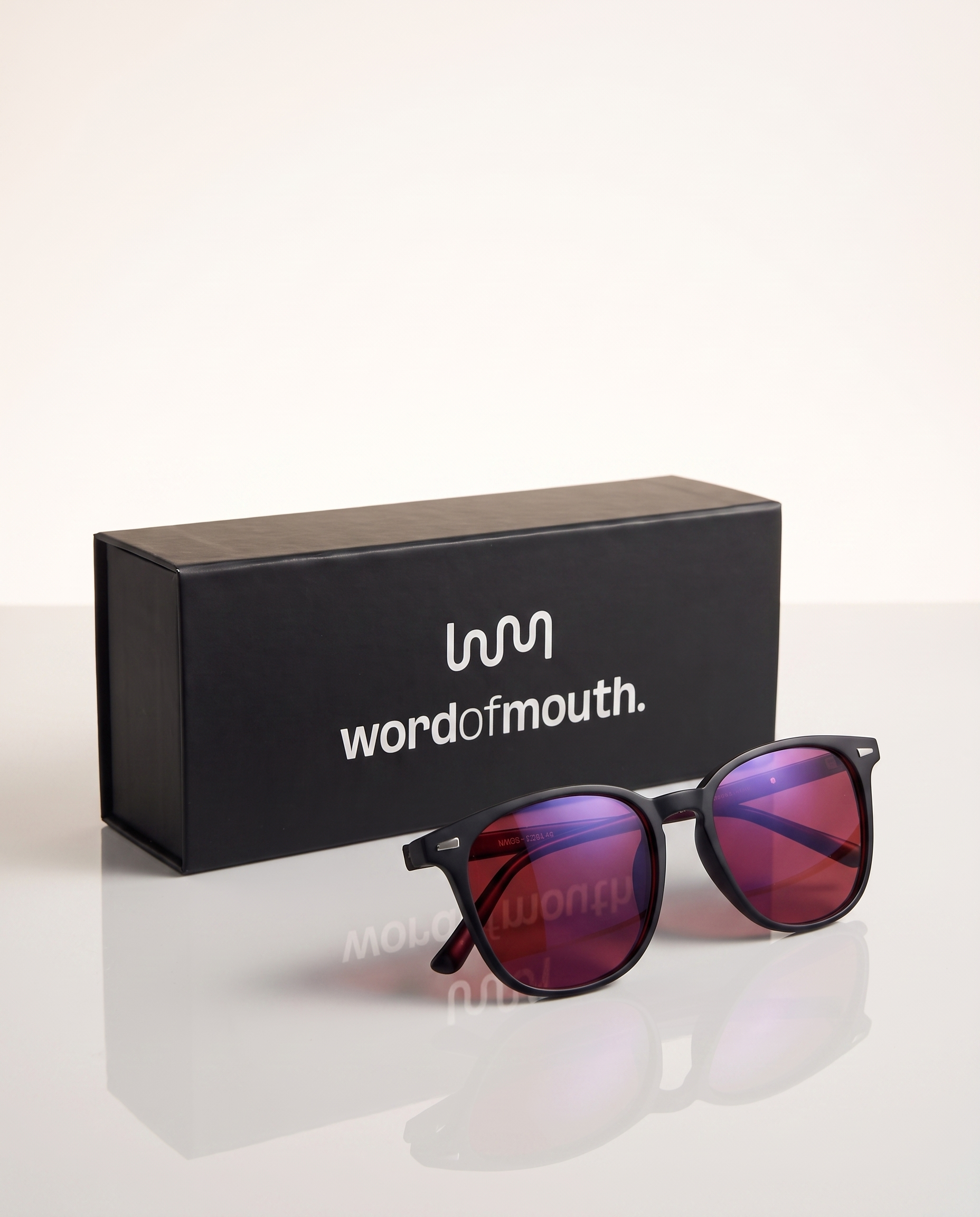 Blue Light Blockers — glasses with wordofmouth. box on light reflective background
