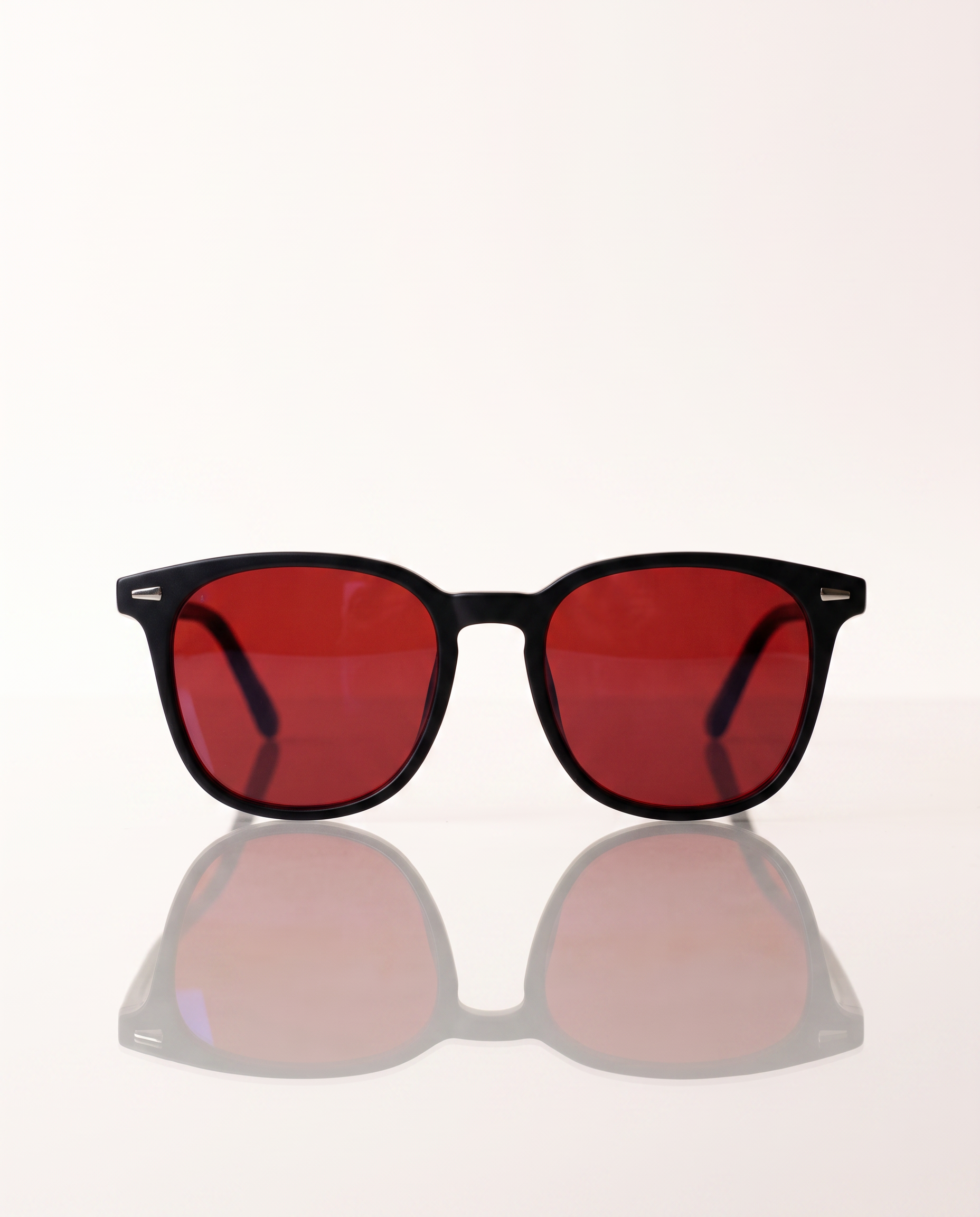 Blue Light Blockers — front-on with mirror reflection on light background