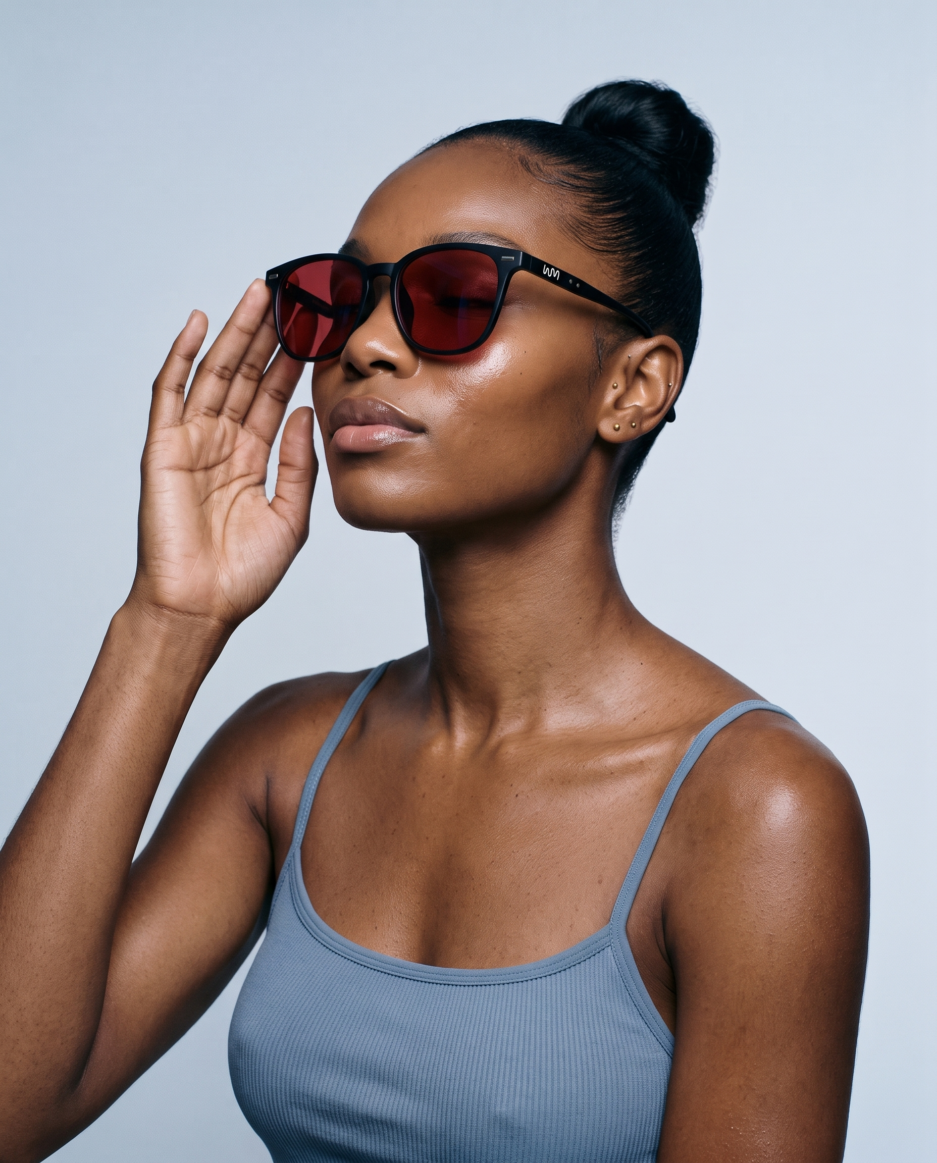 Woman wearing Blue Light Blockers, serene three-quarter portrait