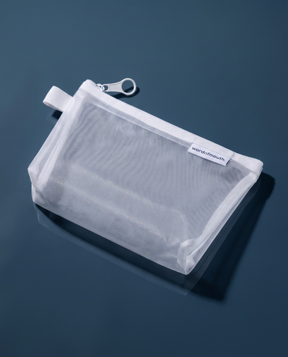 Word of Mouth Essentials Case shown at an angle, showing the white zip and breathable mesh panel